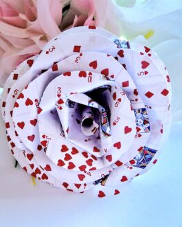 Playing card rose on wooden stem